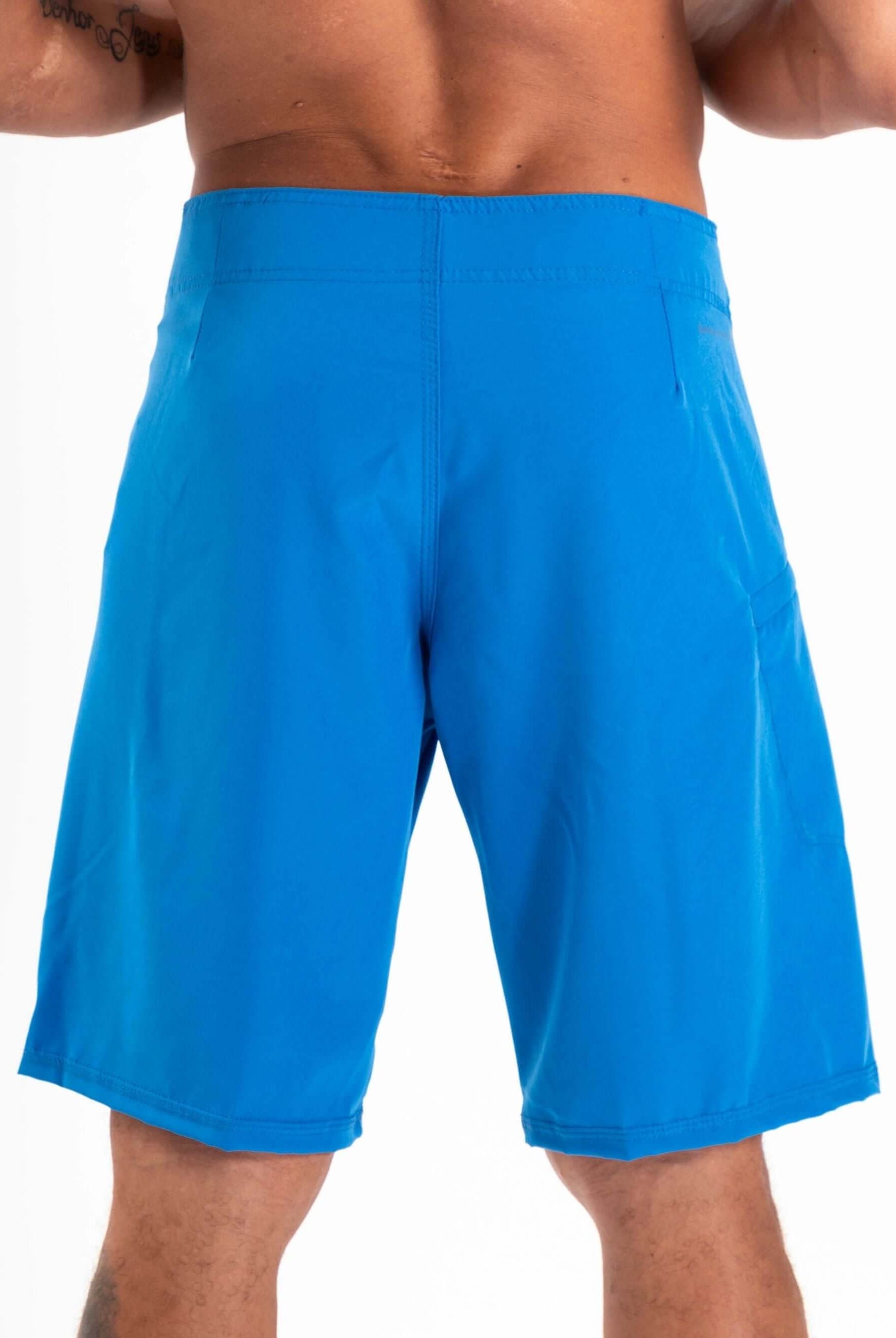 Back view of Greenish BOARDSHORT TOTAL STRETCH in bright blue, designed for high performance and fast drying.
