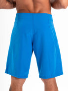 Back view of Greenish BOARDSHORT TOTAL STRETCH in bright blue, designed for high performance and fast drying.