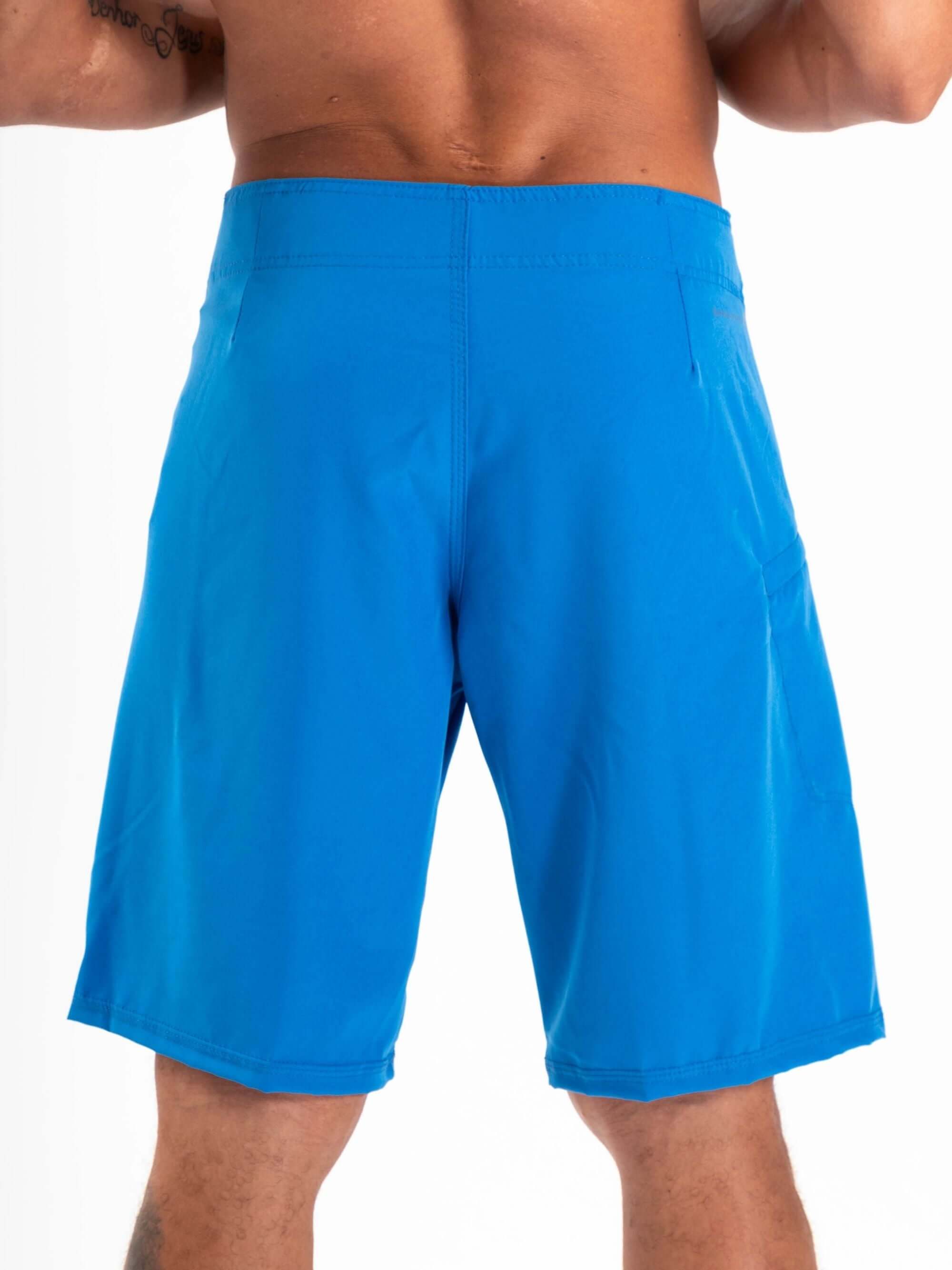 Back view of Greenish BOARDSHORT TOTAL STRETCH in bright blue, designed for high performance and fast drying.