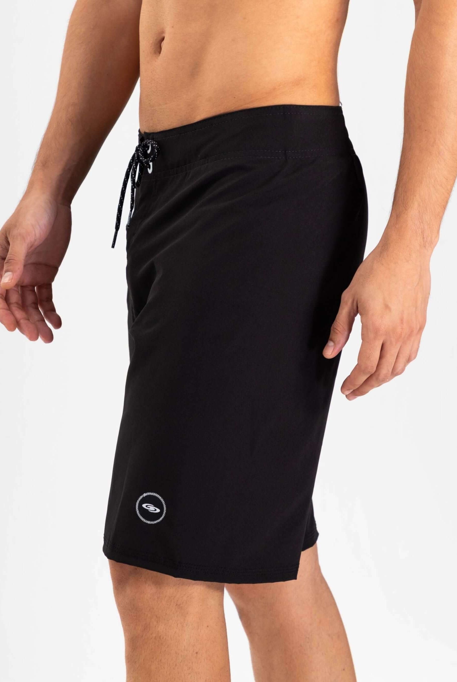 Greenish Total Stretch boardshort in black, designed for high performance water sports and quick drying.