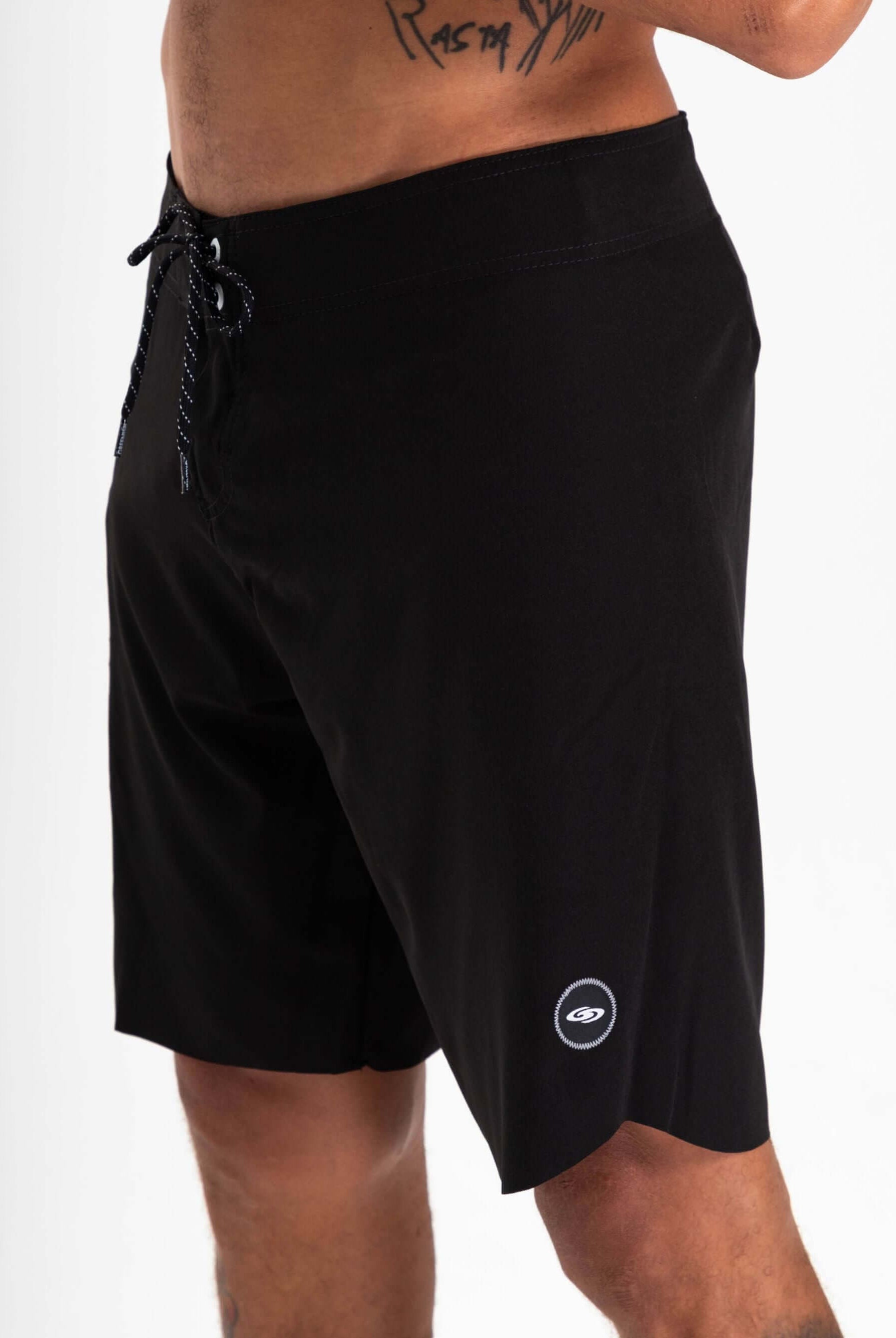 Greenish Ultralight Basic boardshort in black, designed for high performance and ultimate comfort in aquatic sports.