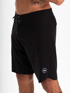 Greenish Ultralight Basic boardshort in black, designed for high performance and ultimate comfort in aquatic sports.