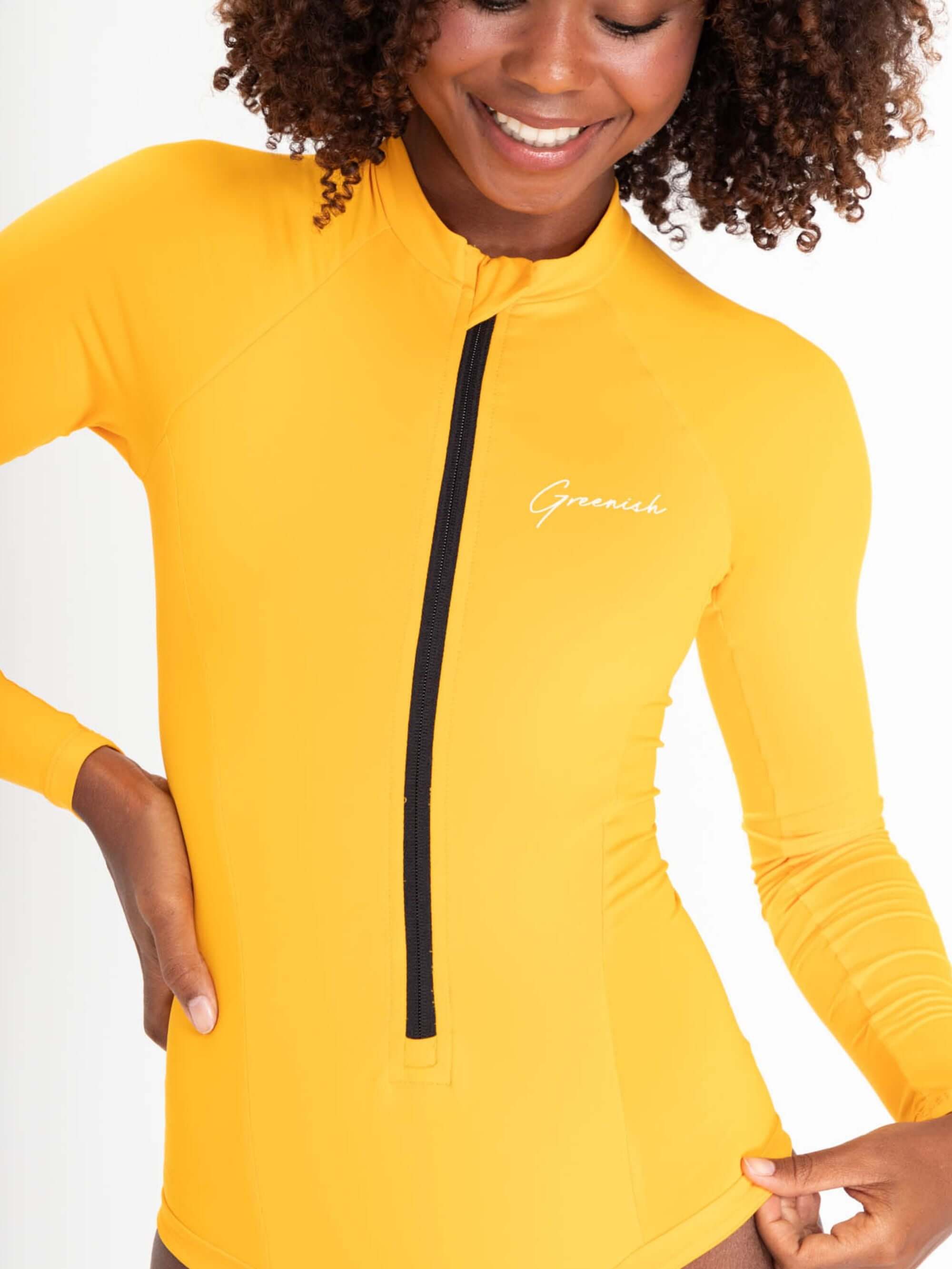 Maiô Solid Color Laranja Claro da Greenish, com fechamento frontal em zíper e proteção UV, ideal para atividades aquáticas.