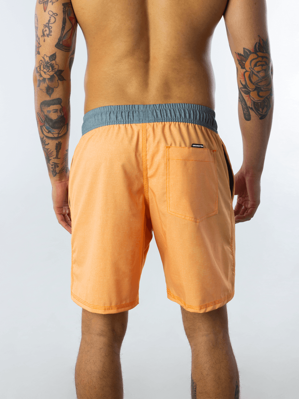 Short vôlei texturizado laranja da marca Greenish, masculino, oferecendo conforto e elasticidade para esportes e passeios.