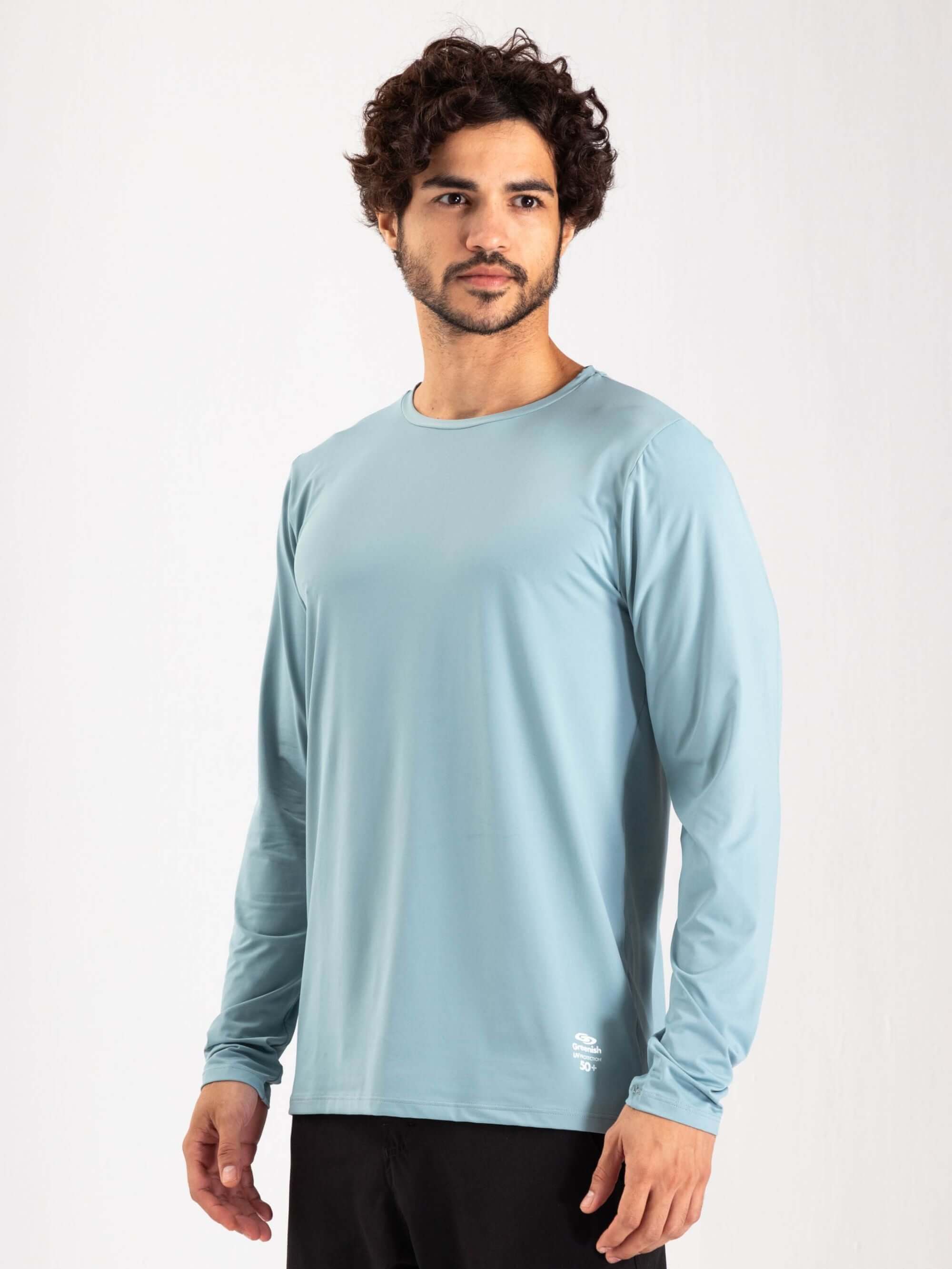 Camisa UV Manga Longa Greenish em tom azul, ideal para proteção solar durante atividades ao ar livre.