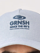 Boné Nineties Azul da Greenish com logo GRNSH, estilo retrô e confortável, perfeito para fãs dos anos 90.