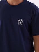 Camiseta azul marinho da Greenish com estampa Surf Icons, ideal para amantes do surf.
