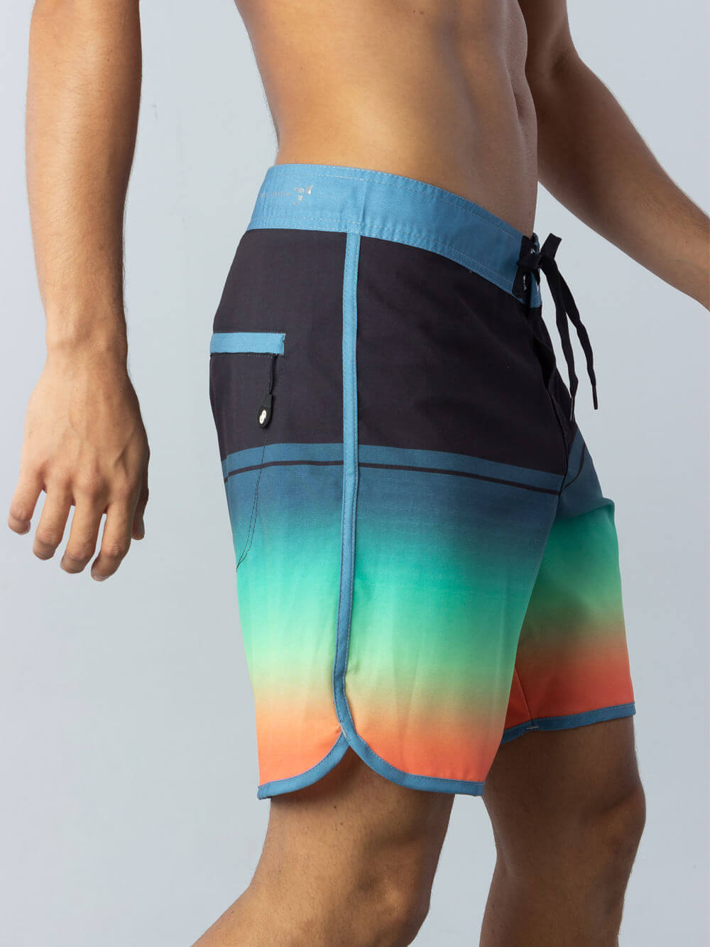 Greenish boardsport gradient block boardshort in black with vibrant tropical gradient colors.