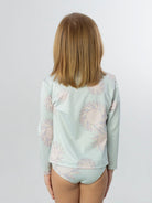 Conjunto UV feminino The Sun da Greenish, azul claro com estampa de girassóis, ideal para proteção solar.