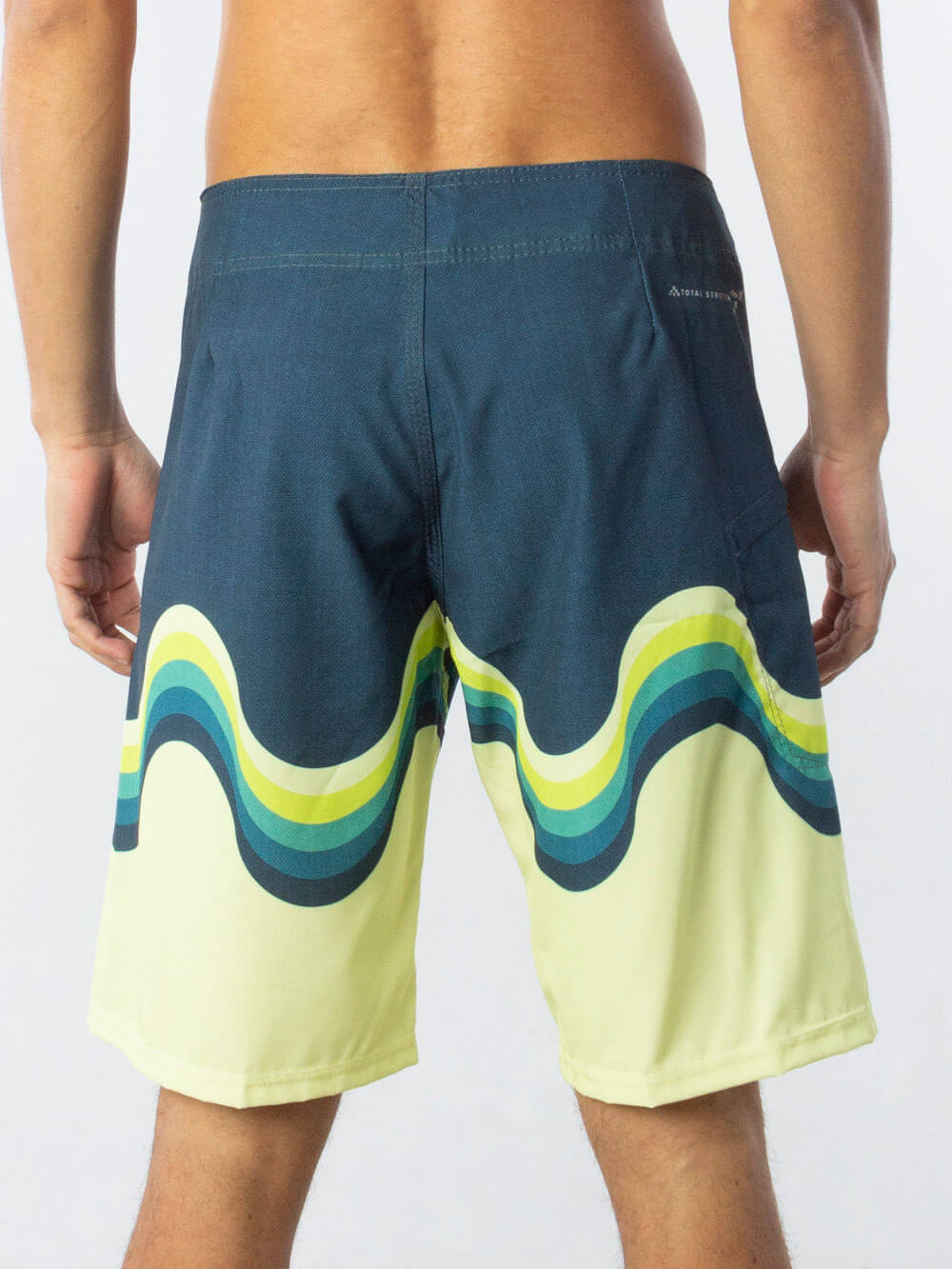 Back view of Greenish Boardshort Retro - Verde showcasing colorful wave design and comfortable fit.