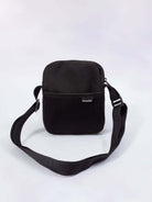 Greenish BAG REEF - CINZA, a stylish black messenger bag with mesh accents, perfect for everyday use.