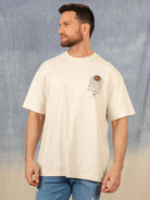 Camiseta oversized bege da Greenish para membros, estilo moderno e confortável, perfeita para o dia a dia.