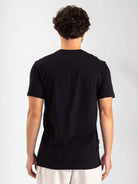 Camiseta preta Greenish 'Simplify Your Living' vista de costas, estilo moderno e confortável.