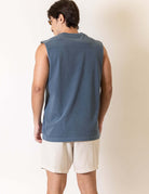 Greenish Regata Larga Tropical Terapy - Azul Marinho displayed on a model from the back view, showcasing the sleeveless design.