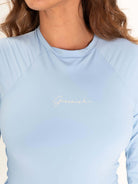 Close-up of the light blue MAIÔ GREENISH BAYSHORE with elegant logo, showcasing comfort and modern design features.