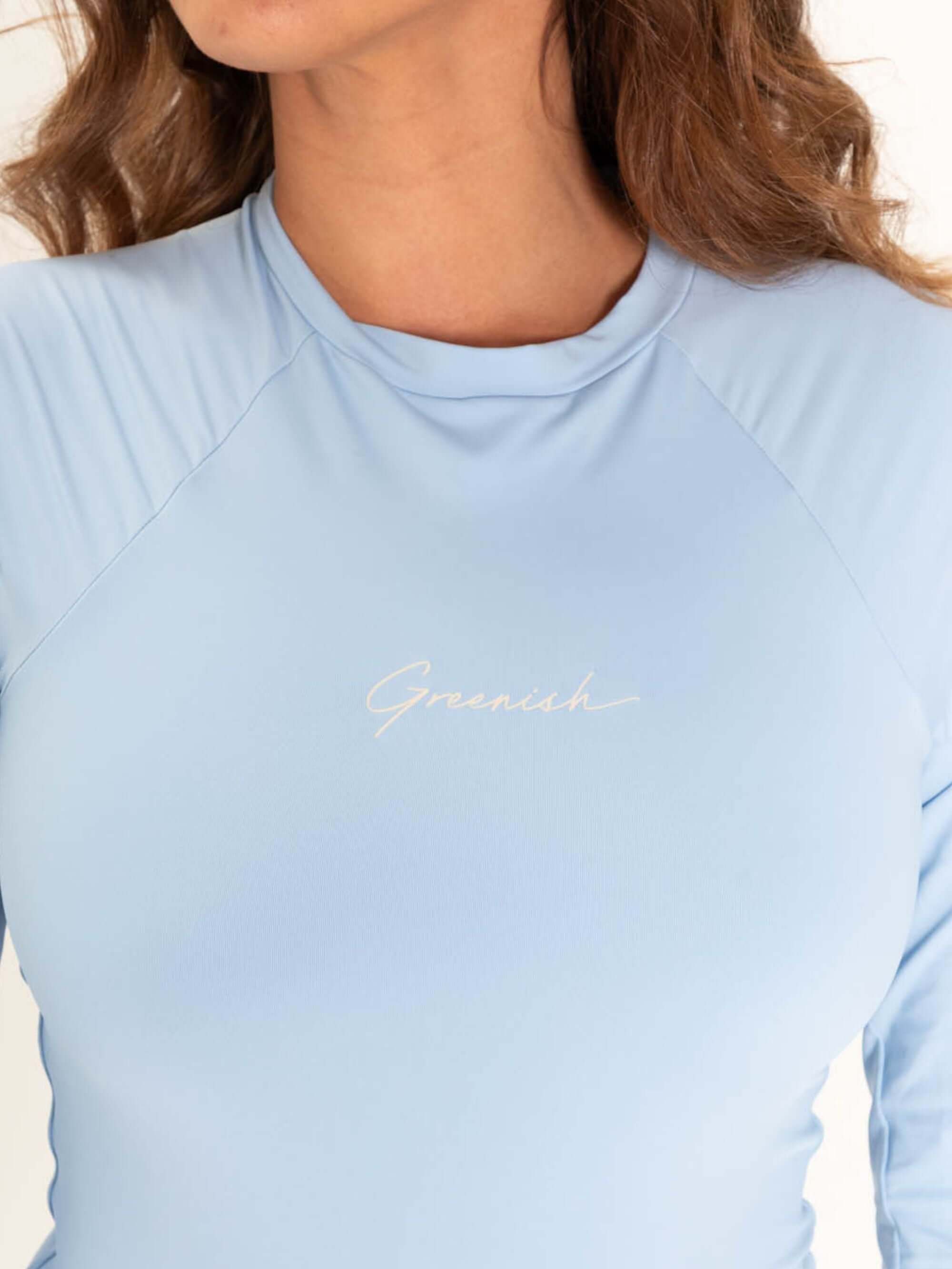 Close-up of the light blue MAIÔ GREENISH BAYSHORE with elegant logo, showcasing comfort and modern design features.