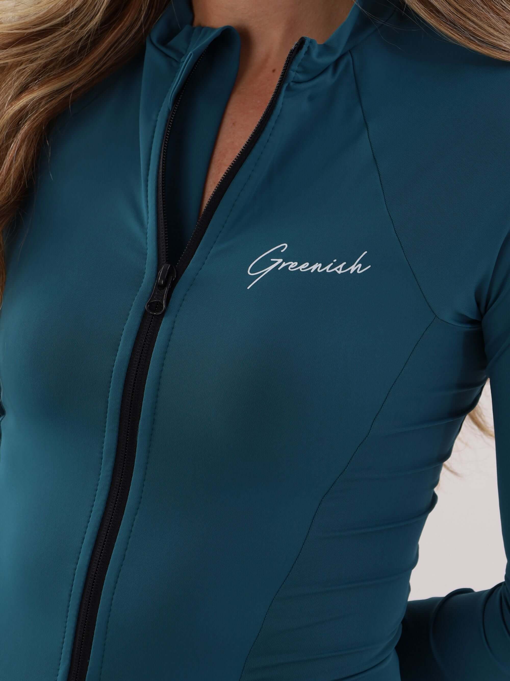 Maiô azul escuro da Greenish com fechamento em zíper e logo evidente, ideal para esportes aquáticos e proteção UV.